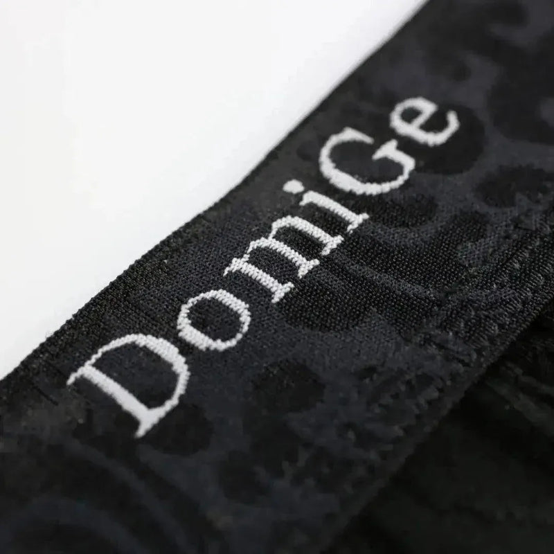 Black boxer briefs waistband — subtle logo detail	