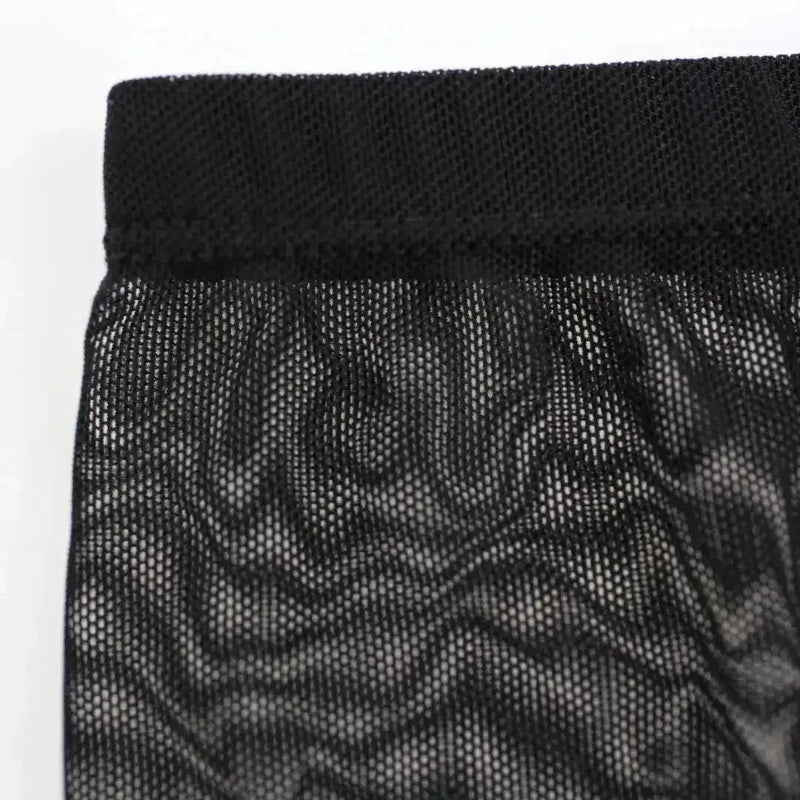 Black sheer mesh fabric detail — lightweight transparent weave	