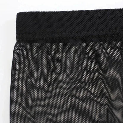 Black sheer mesh fabric detail — lightweight transparent weave	