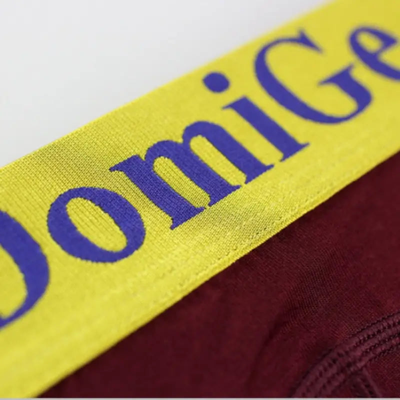 Wine Red modal long johns gold waistband — blue DomiGe logo detail	